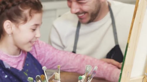 Happy Family Having Fun Drawing at the Art Studio Together