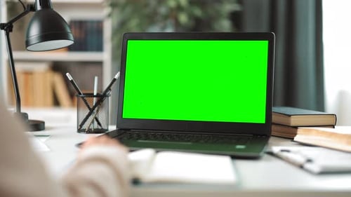 Woman Working on Green Screen Laptop