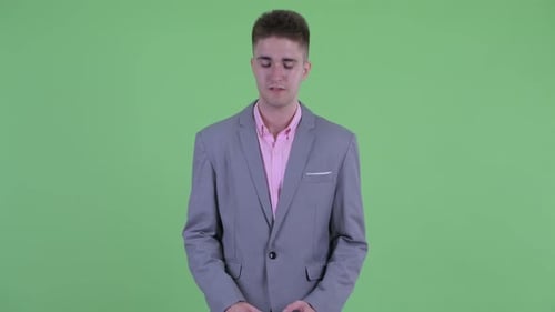 Stressed Young Businessman Getting Bad News