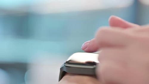 Close up of Female Hands using Smartwatch