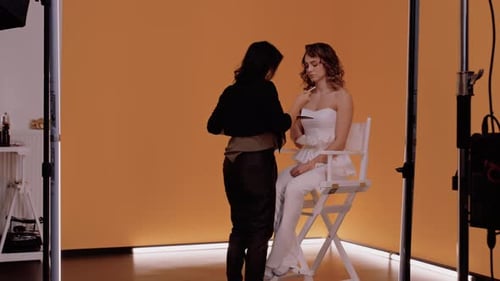 Makeup Artist Applying Makeup to Model