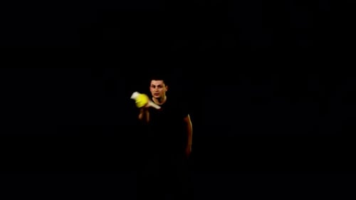 Man Juggling Bottle and Shaker on Black Background