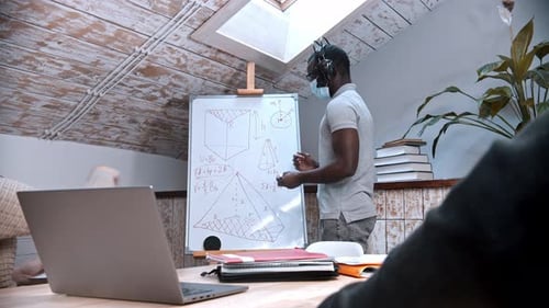 Man Presenting Math Equations to Students at Home
