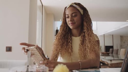 Lady College Student on Her Phone While Taking a Break From Online Studying