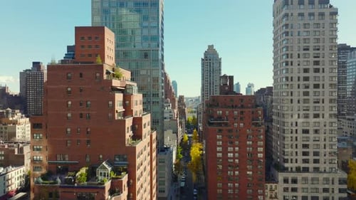 Forwards Fly Above High Rise Buildings in Residential District