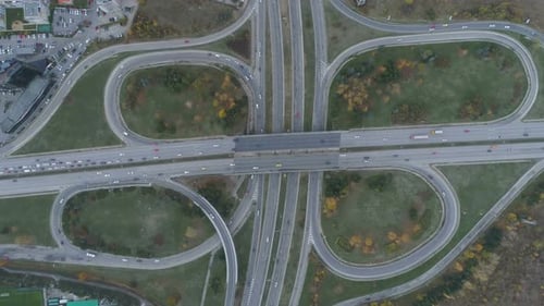 Aerial View Interchange Ring Road and Motorway Freeway Highways and Moving Cars Transportation in