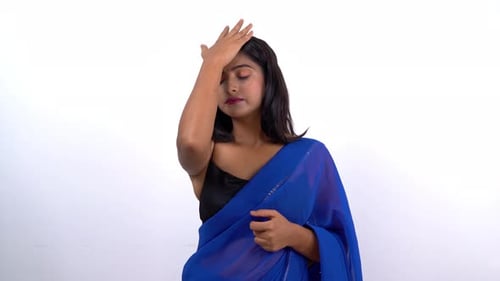 Woman in Saree Expressing Frustration in Studio