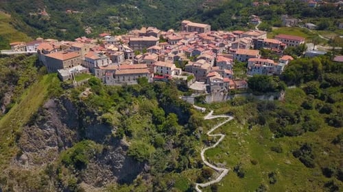 Aerial View of Medieval City on Hill Overlooking the Sea Coast Village and Mountains, Tiled Roofs