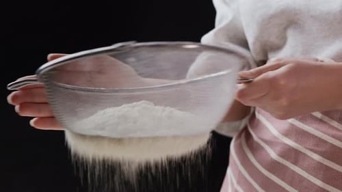 Baker Sifts Flour Through Sieve for Baking Homemade Bread