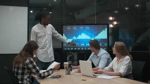 Team Reviewing Financial Data in Modern Office