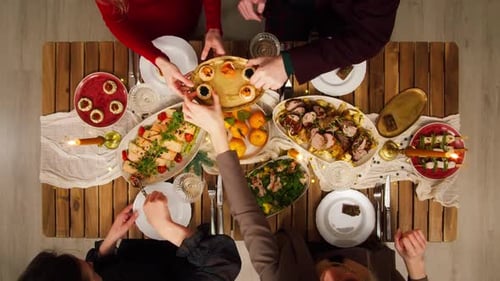 Friends Celebrating New Year Top View Sitting at Dining Table