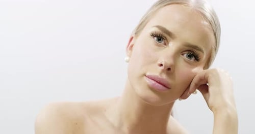 Studio Portrait of Elegant Young Woman with Long Blonde Hair