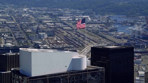 City Aerial View with American Flag Waving