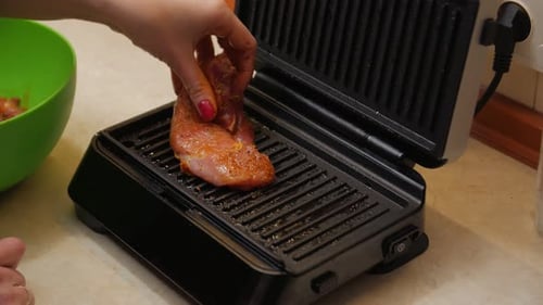 Marinated Meat Cooking on Electric Grill Indoors