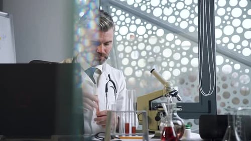 Scientist Analyzes Test Tube in Modern Laboratory