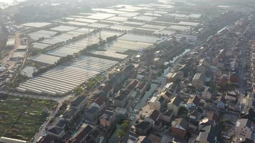 Aerial View of Greenhouses and Town