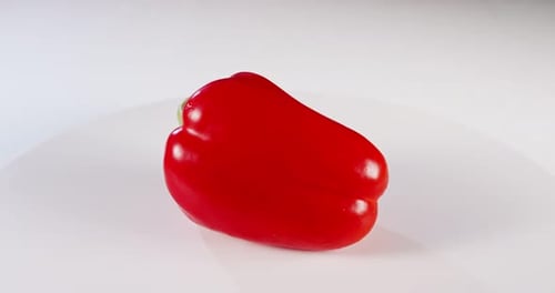 close up a Red bell pepper rotating on a white background