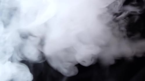 White Smoke Floating Through Space Against Black Background. Mist, Smoke , Vapor, Fog Effect. Slow