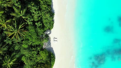 Wide overhead travel shot of a summer white paradise sand beach and aqua turquoise water background