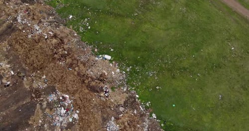 Aerial View of Landfill Bordering Grassy Field