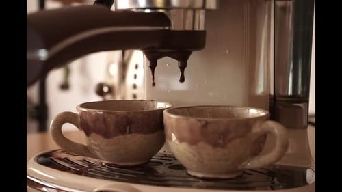 Espresso Machine Fills Two Mugs with Coffee