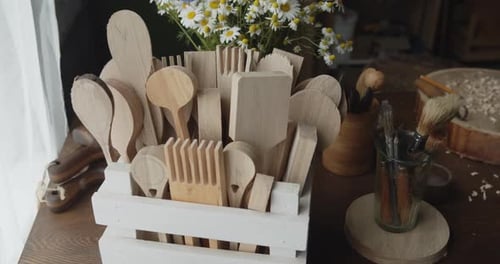 Handcrafted Wooden Utensils on a Wooden Table