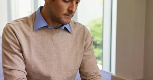 Male business executive using digital tablet in office 4k