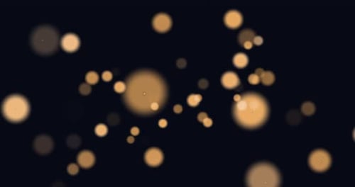 Animation von leuchtend orangefarbenen Lichtflecken, die sich in hypnotischer Bewegung auf schwarzem Hintergrund bewegen