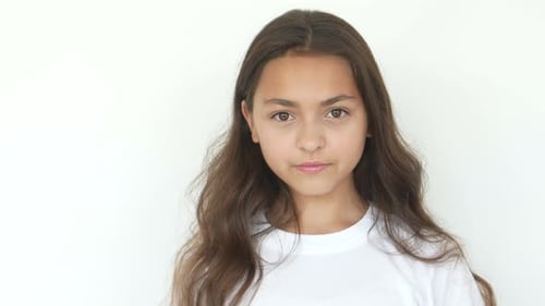 Smiling Teen Girl Posing in Front of Camera