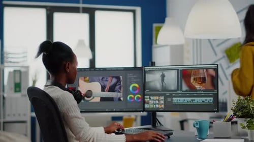 Woman Working on Video Editing in Modern Office