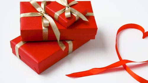 Festive Red Gifts with Gold Ribbons and Heart