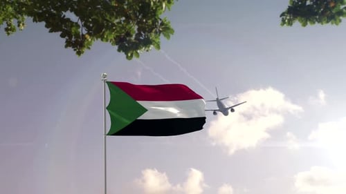 Waving Sudan Flag with Airplane Flying Over City Skyline