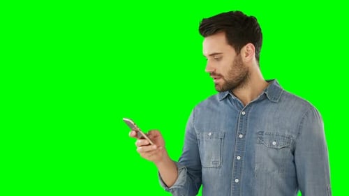 Smiling man using mobile phone