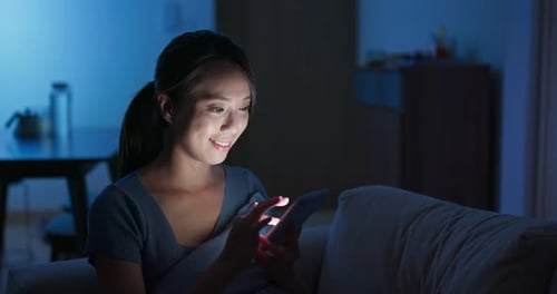 Woman use of tablet at night