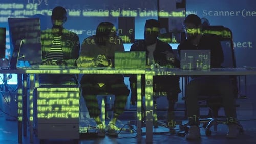 Coders Working at Computers with Code Overlay