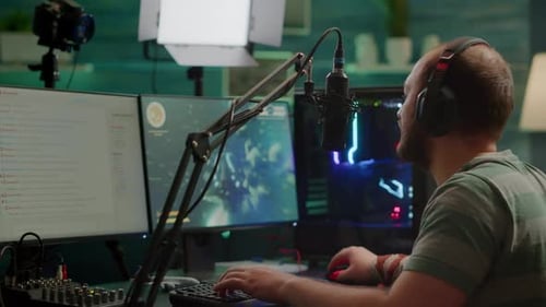 Man Playing Video Game with Headphones and Microphone