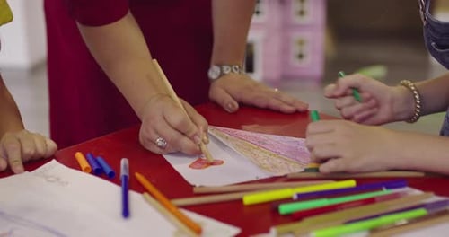 Creative Kids During an Art Class in a Daycare Center or Elementary School Classroom Drawing with