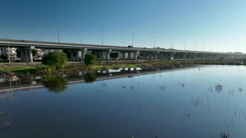 Traffic in the reflection of water aerial view 4 K