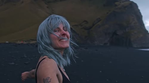 Beautiful Blue Haired Girl On Black Beach