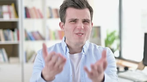 Stressed Man Expresses Frustration to the Camera