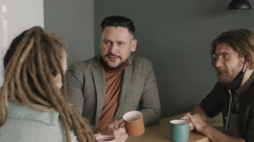 Slowmo of Office Colleagues Chatting over Coffee