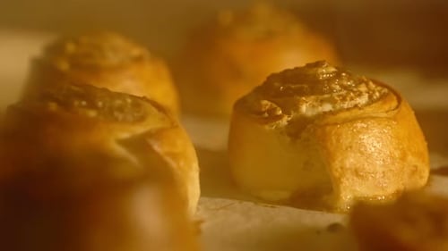 Freshly Baked Cinnamon Rolls Baking in Oven