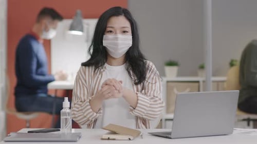 Young Adult in Surgical Mask Talking on Video Call