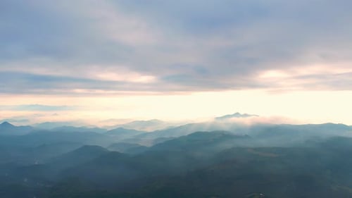 4K Aerial view of Mountains landscape with morning fog.