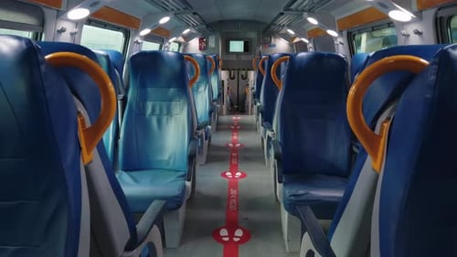 Interior of a Train Wagon with Empty Seats