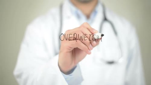 Doctor Writes "Overweight" on Clear Surface