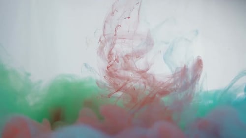 Colorful Ink Plumes Swirling in Water