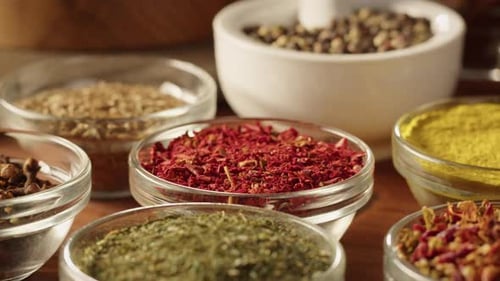 Dried Herbs and Spices Arranged in Bowls