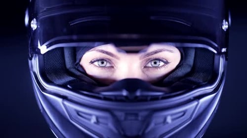 Intense Close Up: Woman's Eyes in Helmet