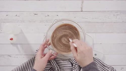 Mixing Ingredients in Bowl For Tasty Dessert